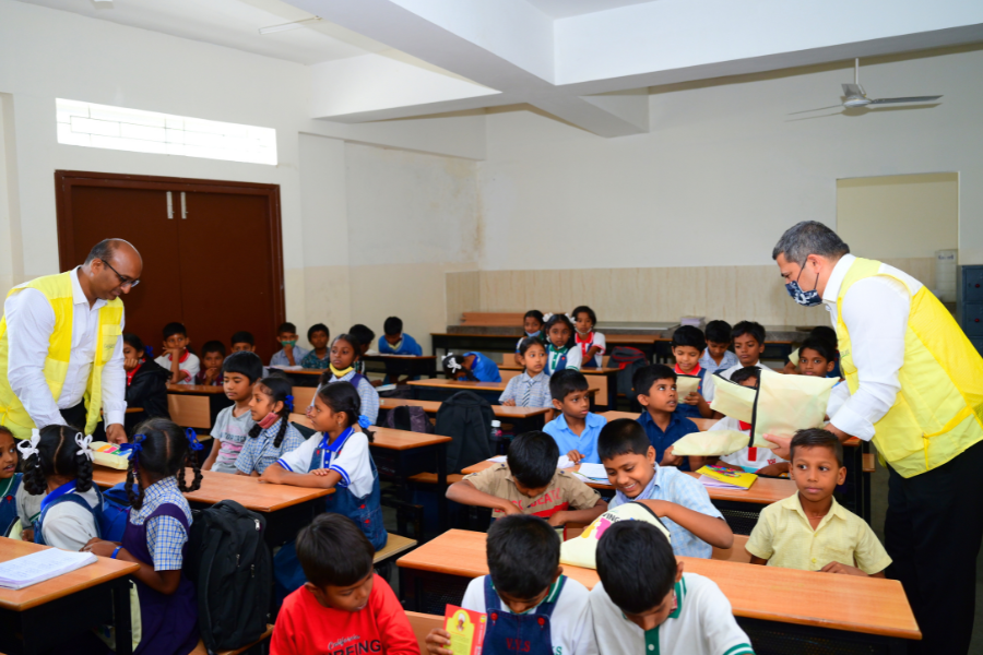A classroom of young students and teachers or volunteers