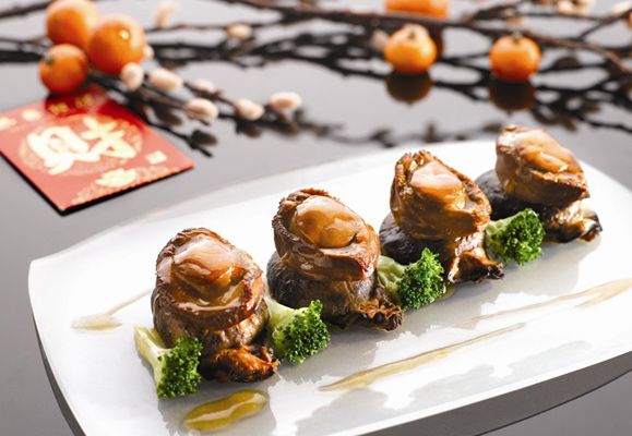 Braised Whole Abalones, White Flower Mushrooms and Dried Jumbo Oysters and Broccoli incorporates the best of auspicious seafood in a single dish
