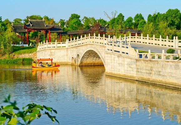 Suzhou is a city criss-crossed with rivers and canals which are connected by many bridges, earning it the nickname, Venice of the East
