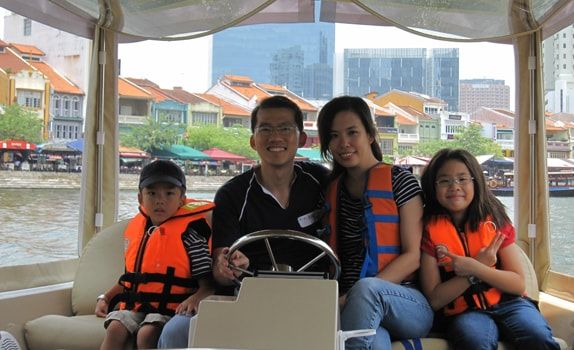 Connecting with his family is equally if not more important. Mr Ng and his family sailing down the Singapore River at a CapitaLand CSR event.