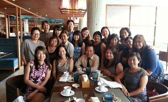 A team that eats together stays together: Mr Wong with his dedicated team of marketing staff.