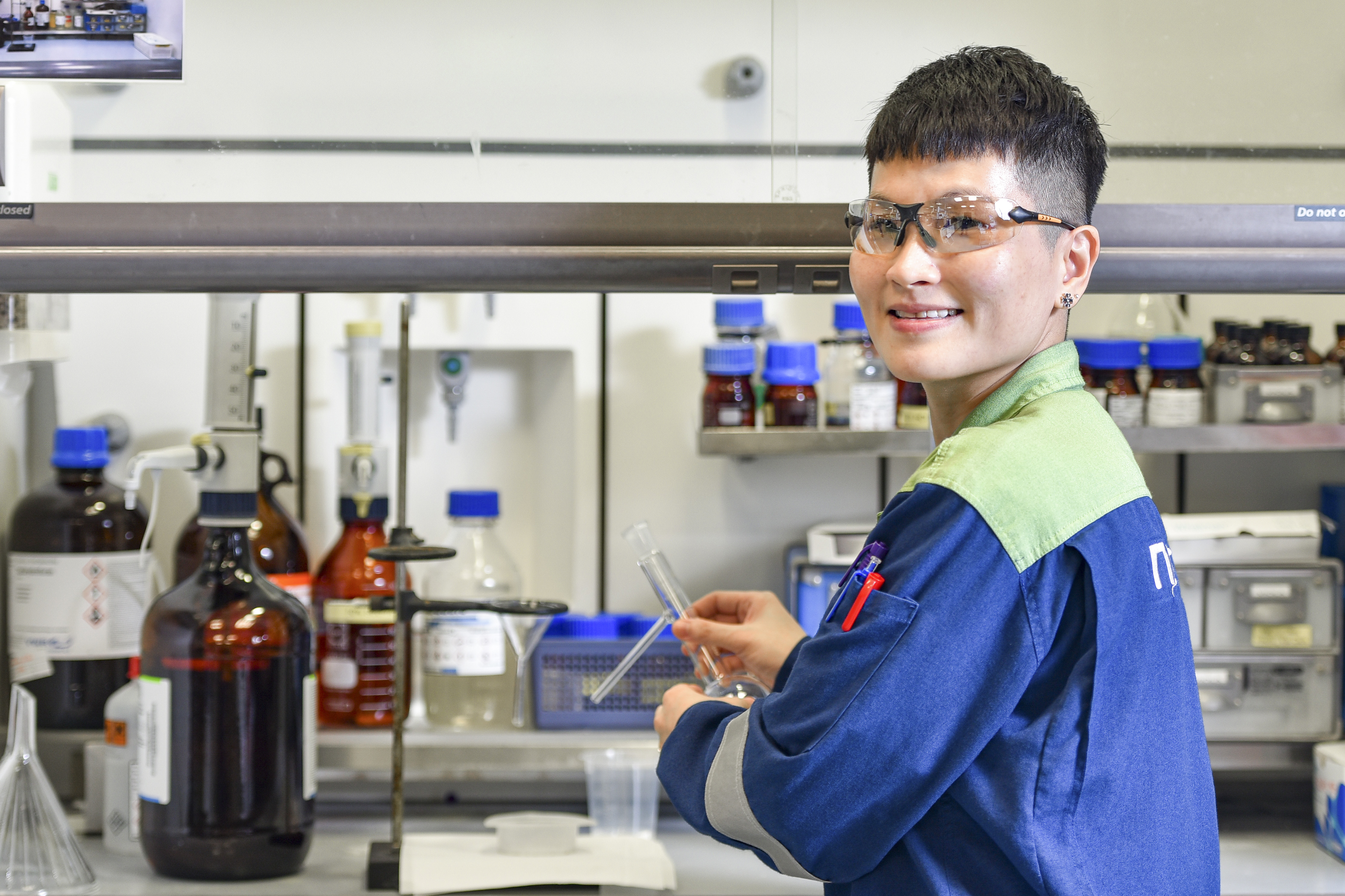 scientist working at neste singapore refinery lab